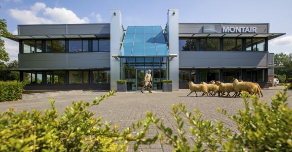 Business premises of Montair Environmental Solutions where a shepherd with sheep walks past